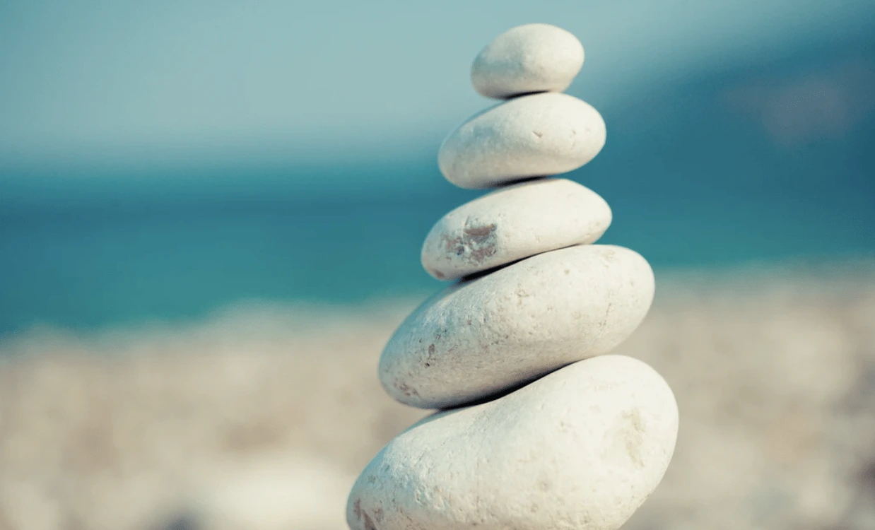 A small zen sand garden with stones — calm, intentional space