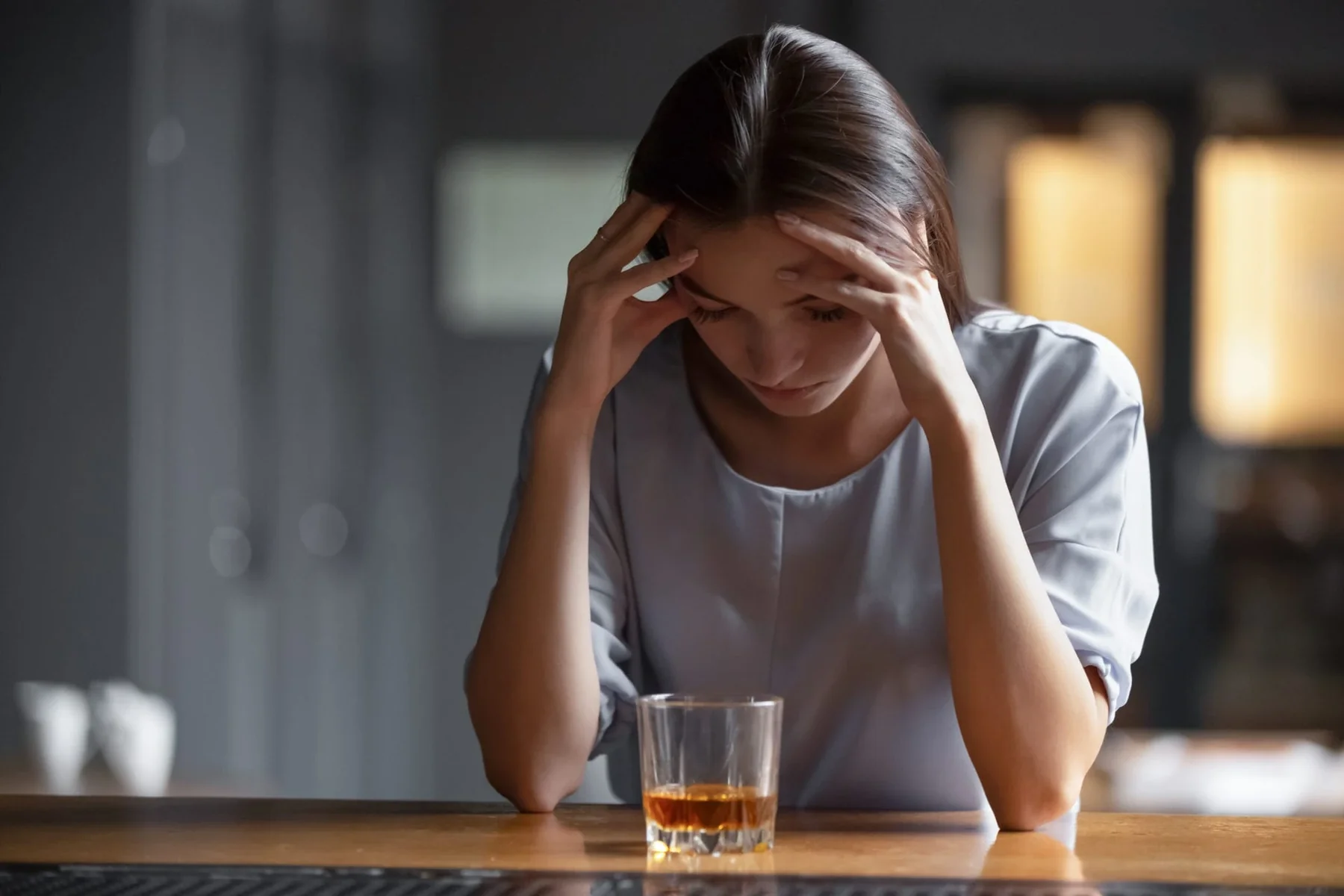 A woman resting and reflecting in a quiet setting