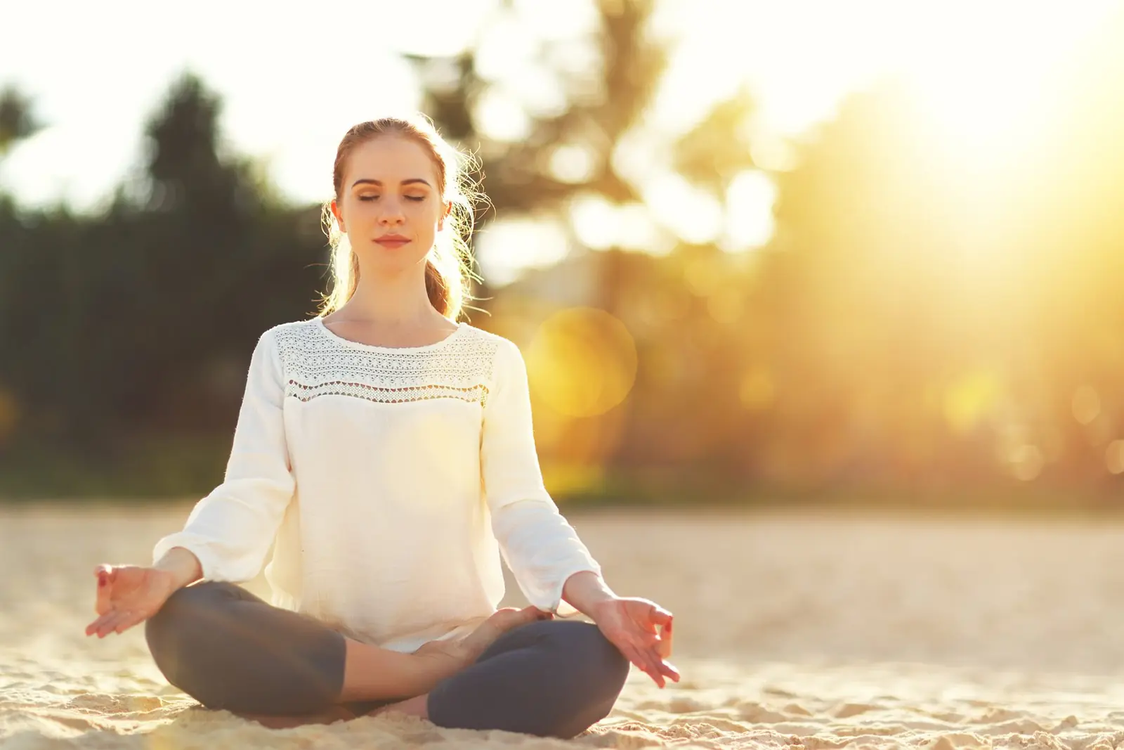 A peaceful outdoor therapy setting with a woman in nature — calm, contemplative.