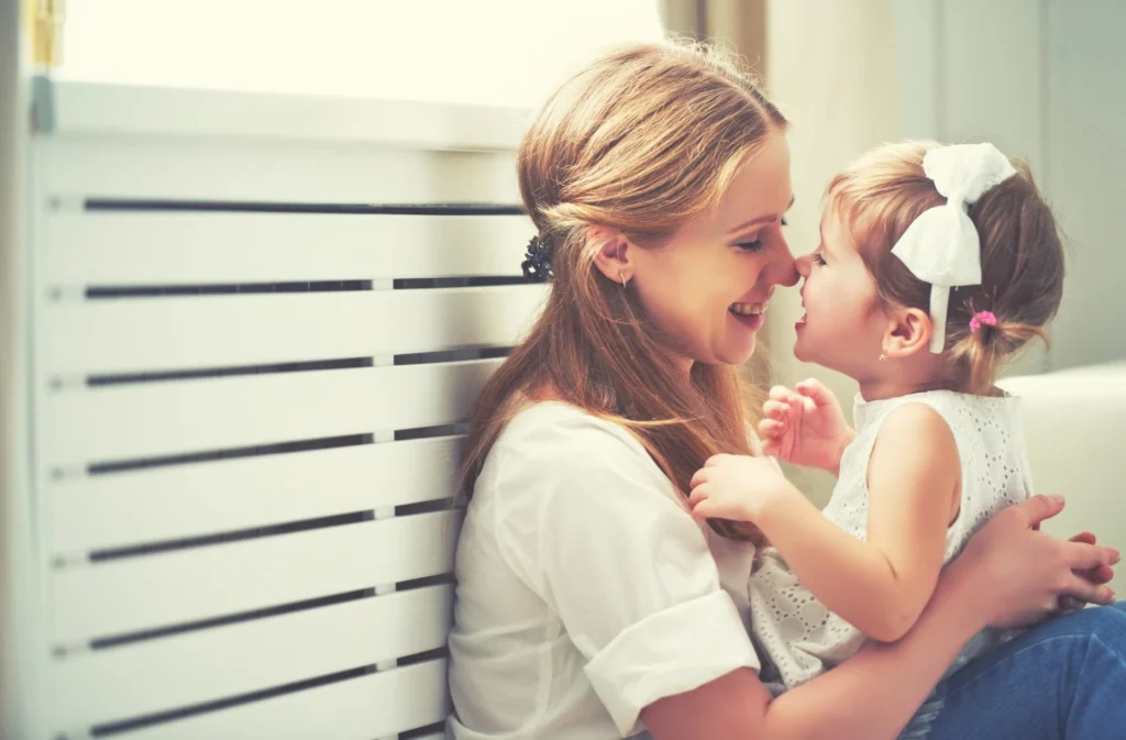 Becoming a Sober Mom - mother sharing smiles with baby girl