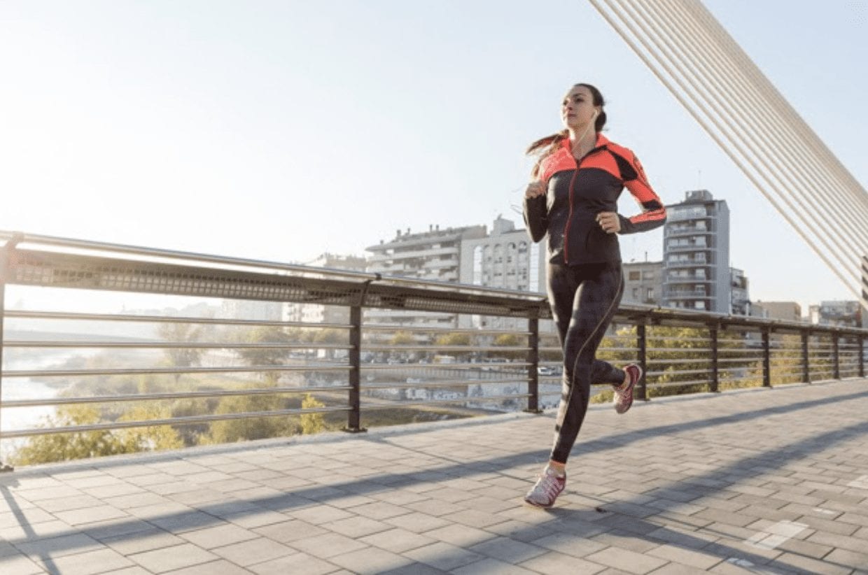 A woman running outdoors — rebuilding daily life and movement in recovery