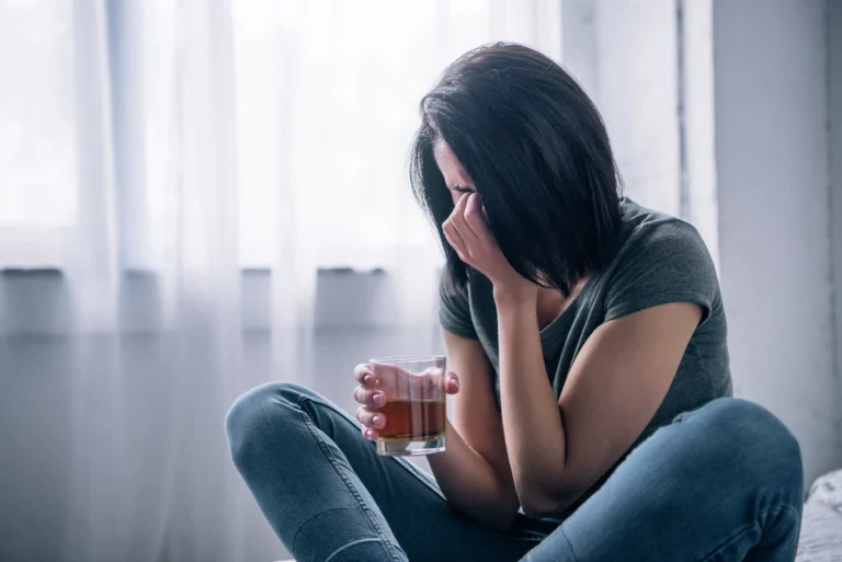 depressed-woman-with-whiskey-glass-crying-at-home