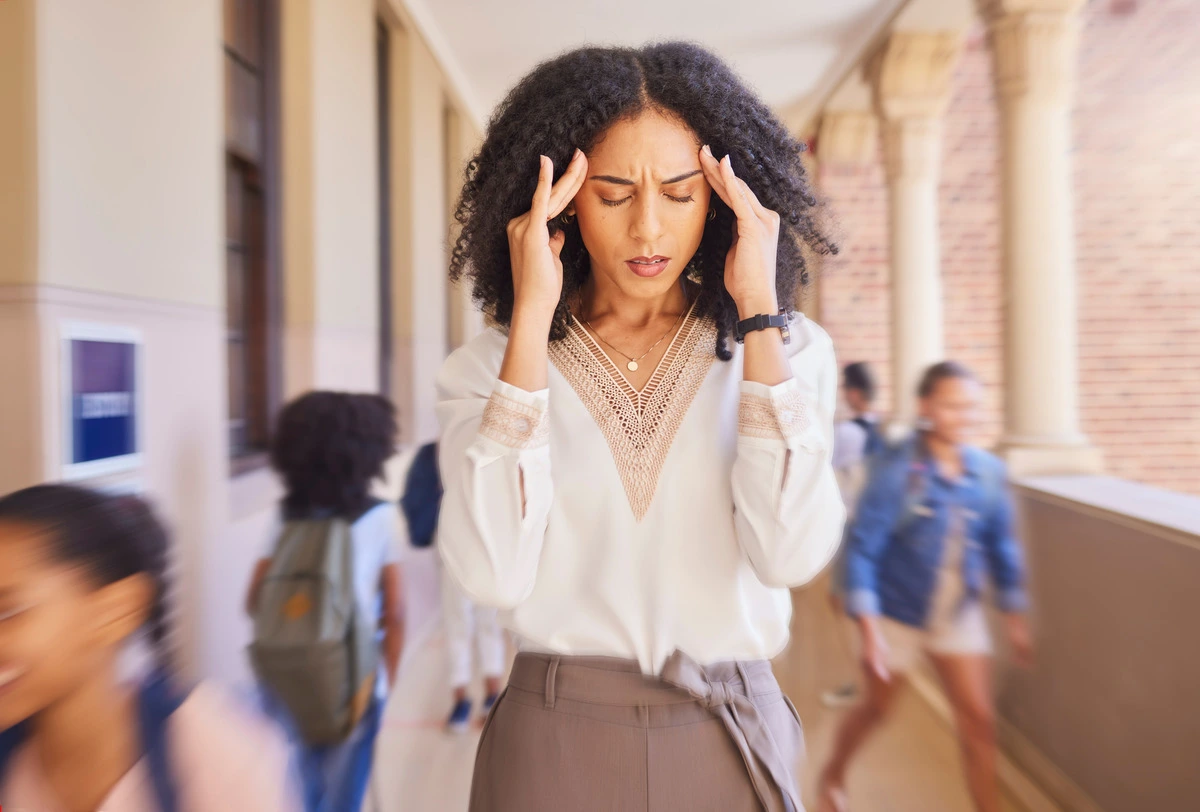 breaking free from xanax - female teacher walking with headache